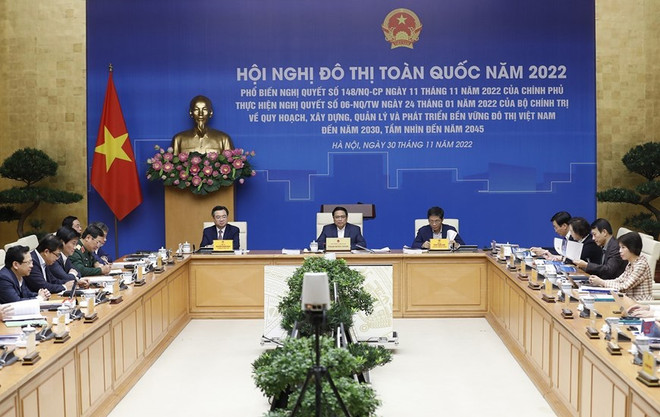 Thủ tướng Phạm Minh Chính chủ trì hội nghị. (Ảnh: Dương Giang/TTXVN) Nâng cao lượng và chất của quá trình đô thị hóa, phát triển đô thị ảnh 1