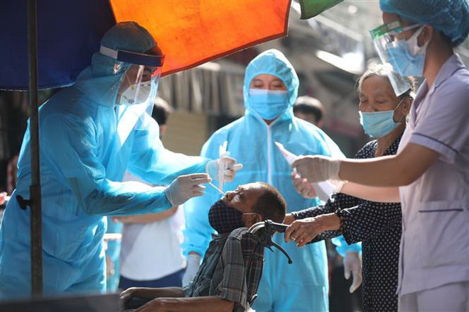 Việt Nam ghi nhận 12.607 ca mắc mới COVID-19, TP.HCM có 5.444 ca ảnh 1