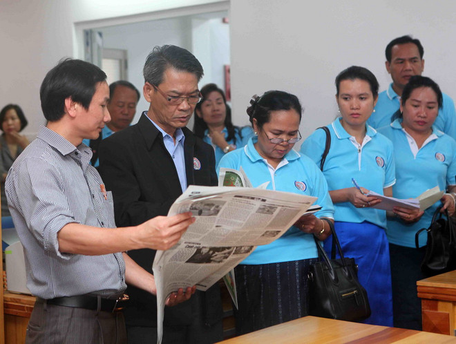 Đoàn Hãng Thông tấn xã Lào (KPL) thăm và trao đổi nghiệp vụ với Báo Nghệ An. (Ảnh: Thanh Tùng/TTXVN) Đoàn công tác của TTXVN và Thông tấn xã Lào làm việc tại Nghệ An ảnh 2