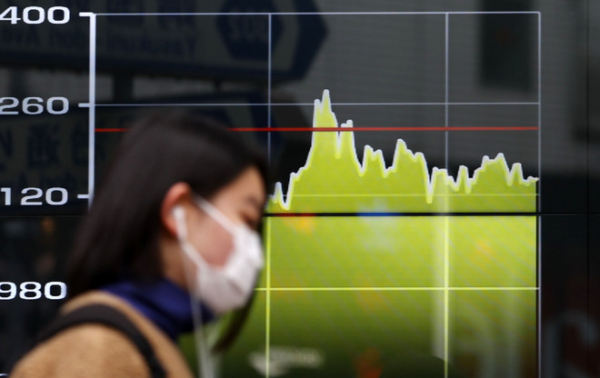 Chứng khoán châu Á biến động trái chiều sau quyết định của Fed ảnh 1