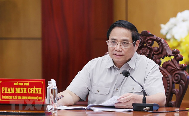 Thủ tướng Phạm Minh Chính chủ trì làm việc với lãnh đạo chủ chốt tỉnh Long An. (Ảnh: Dương Giang/TTXVN) Thủ tướng: Tạo sự phát triển bứt phá, nâng tầm vị thế Long An ảnh 1
