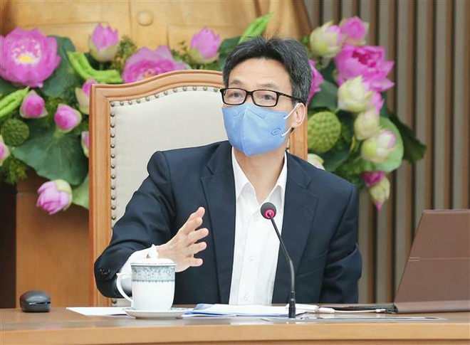 Phó Thủ tướng Vũ Đức Đam phát biểu. (Ảnh: Doãn Tấn/TTXVN) Bộ Y tế lên tiếng về thông tin biến chứng khi tiêm vaccine AstraZeneca ảnh 1