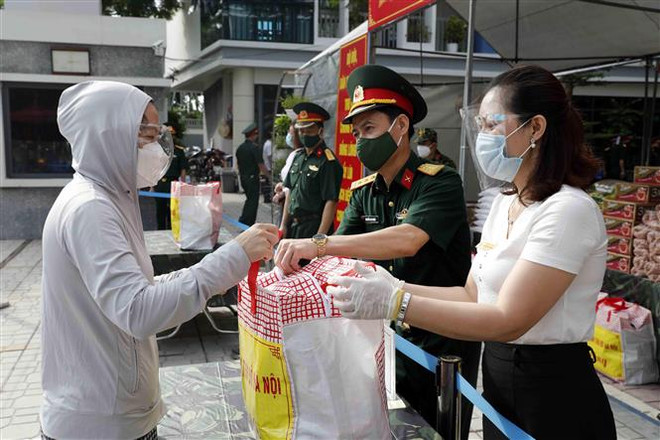 Người lao động trong bối cảnh COVID-19: Mất việc và gánh nặng chi phí ảnh 2