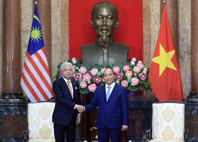 Chủ tịch nước Nguyễn Xuân Phúc tiếp Thủ tướng Malaysia Ismail Sabri Yaakob thăm chính thức Việt Nam. (Ảnh: Thống Nhất/TTXVN) Việt Nam-Malaysia phấn đấu nâng cao kim ngạch thương mại hai chiều ảnh 1