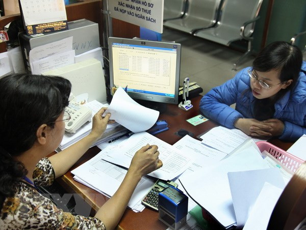 Ảnh minh họa. (Nguồn: TTXVN) Đề nghị điều chỉnh mức giảm trừ gia cảnh từ 9 lên 11 triệu đồng ảnh 1