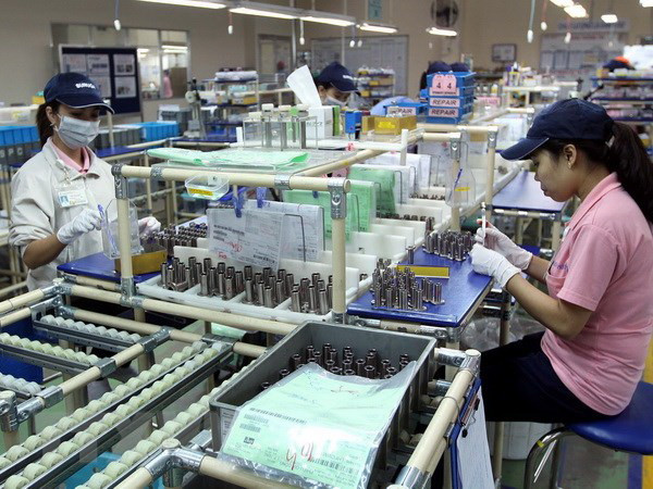 Sản xuất linh kiện cơ khí tại Khu chế xuất Linh Trung, Thủ Đức, Thành phố Hồ Chí Minh. (Ảnh: Thanh Vũ/TTXVN) Cởi bỏ 'chiếc áo' chật hẹp, TP.HCM nỗ lực xây dựng đô thị thông minh ảnh 2