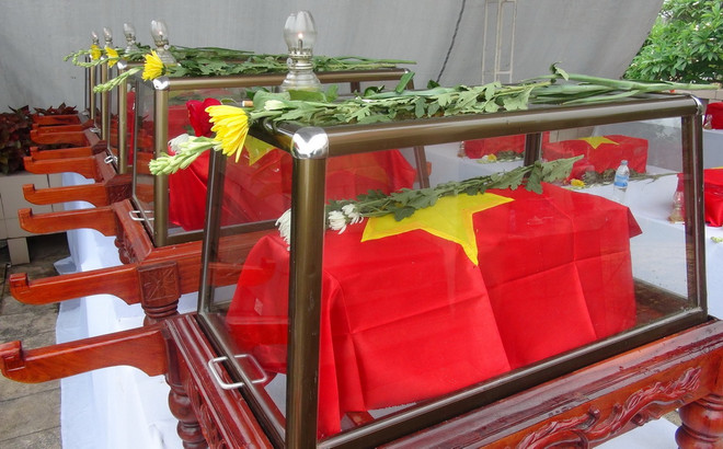 Tiếp nhận, an táng 26 hài cốt liệt sỹ Việt Nam hy sinh tại Lào ảnh 1