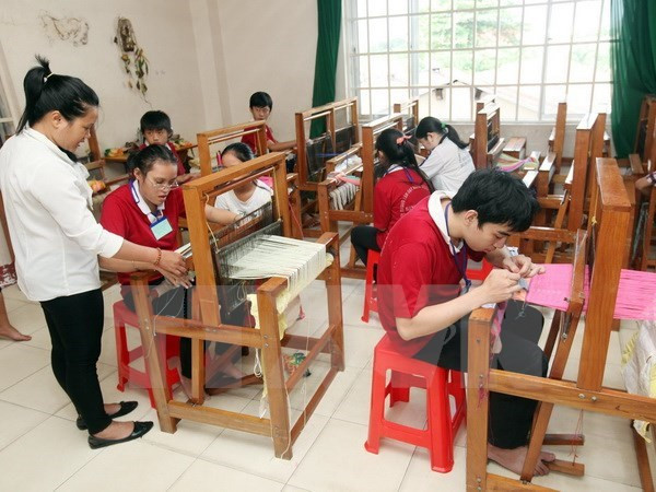Một lớp dạy nghề cho người khuyết tật. (Ảnh minh họa: Anh Tuấn/TTXVN) KOICA tài trợ xây dựng Trung tâm chăm sóc người khuyết tật ở Quảng Trị ảnh 1