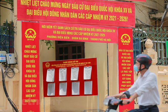 Panô, băng rôn tuyên truyền về bầu cử. (Nguồn: Vietnam+) Thời tiết trên cả nước như thế nào trong ngày bầu cử sắp tới? ảnh 1