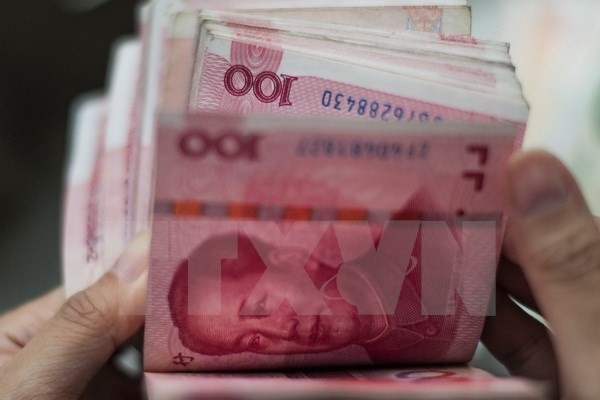Đồng nhân dân tệ. (Nguồn: AFP/TTXVN) Tỷ giá nhân dân tệ giảm xuống mức thấp nhất trong hơn 8 năm ảnh 1