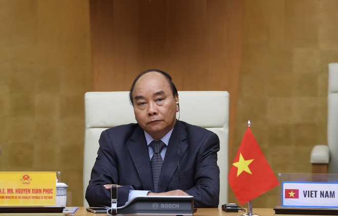 Thủ tướng Nguyễn Xuân Phúc tham dự Hội nghị thượng đỉnh trực tuyến G20 về ứng phó dịch COVID-19. (Ảnh: Thống Nhất/TTXVN) Phối hợp hành động toàn cầu, chiến thắng đại dịch COVID-19 ảnh 2