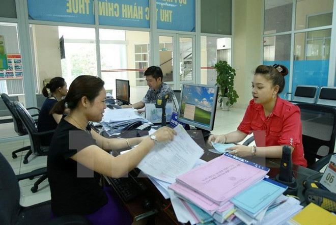 Ảnh minh họa. (Nguồn: TTXVN) Tránh hợp nhất mang tính cơ học đội ngũ cán bộ công chức của nhiều xã ảnh 2