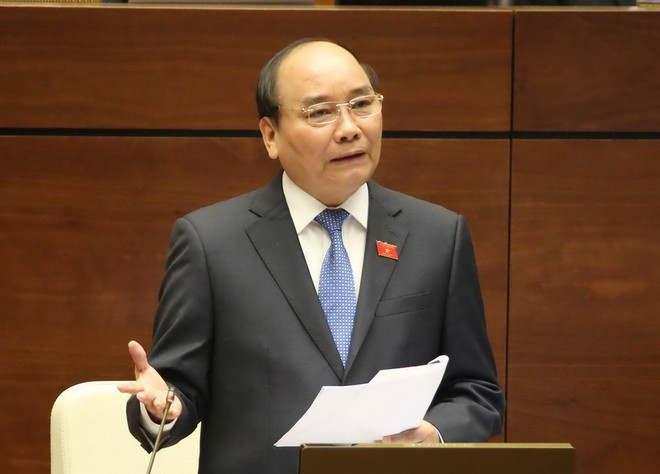 Thủ tướng Chính phủ Nguyễn Xuân Phúc trả lời chất vấn các đại biểu quốc hội. (Ảnh: Phương Hoa/TTXVN) Cử tri ấn tượng với phần trả lời chất vấn của Thủ tướng Chính phủ ảnh 1