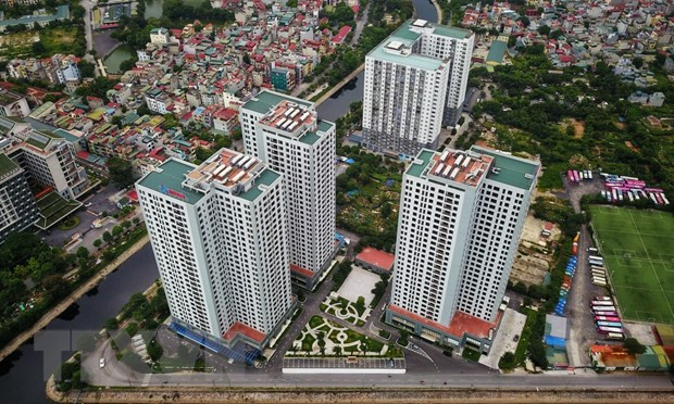 Ảnh minh họa. (Nguồn: TTXVN) Bất động sản văn phòng dẫn đầu các thương vụ mua bán-sáp nhập ảnh 2