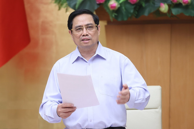 Thủ tướng Chính phủ Phạm Minh Chính phát biểu. (Ảnh: Dương Giang/TTXVN) Thủ tướng: Giãn cách nghiêm túc, không để 'chặt ngoài, lỏng trong' ảnh 1