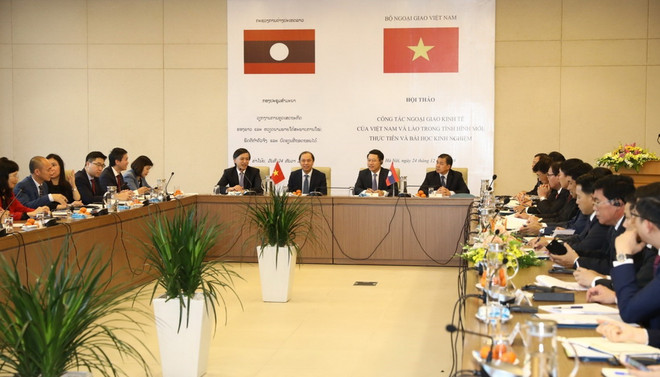 Việt Nam-Lào đẩy mạnh công tác ngoại giao kinh tế trong tình hình mới ảnh 1