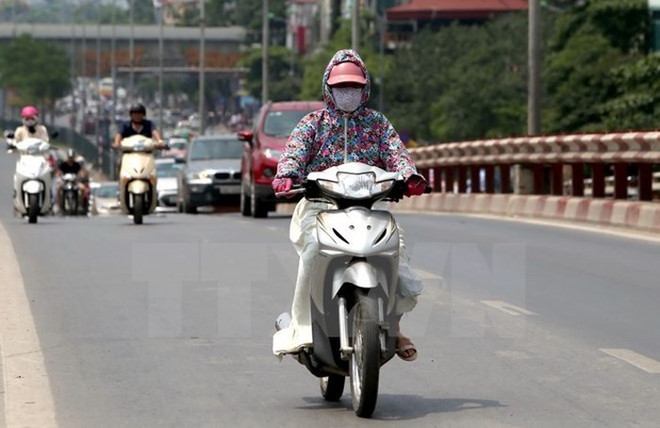 Ảnh minh họa. (Nguồn: TTXVN) Khu vực Trung Bộ nắng nóng, thủ đô Hà Nội có mưa rào và dông ảnh 1