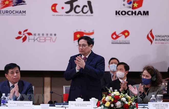 Phiên cấp cao Diễn đàn doanh nghiệp Việt Nam thường niên (VBF) tập trung thảo luận 3 chủ đề chính. (Ảnh: Dương Giang/TTXVN) VBF: Việt Nam cùng cộng đồng quốc tế hài hòa lợi ích, chia sẻ rủi ro ảnh 1