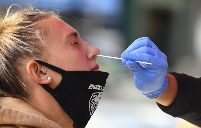 CDC Mỹ: Người mắc COVID-19 không nhất thiết phải xét nghiệm lại ảnh 1