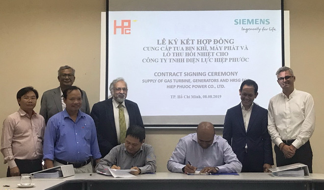 Lễ ký kết hợp đồng cung cấp tuabin khí, máy phát và lò thu hồi nhiệt cho Công ty Điện lực Hiệp Phước. (Nguồn: Siemens) Siemens hỗ trợ nâng cấp nhà máy nhiệt điện tại Thành phố Hồ Chí Minh ảnh 1
