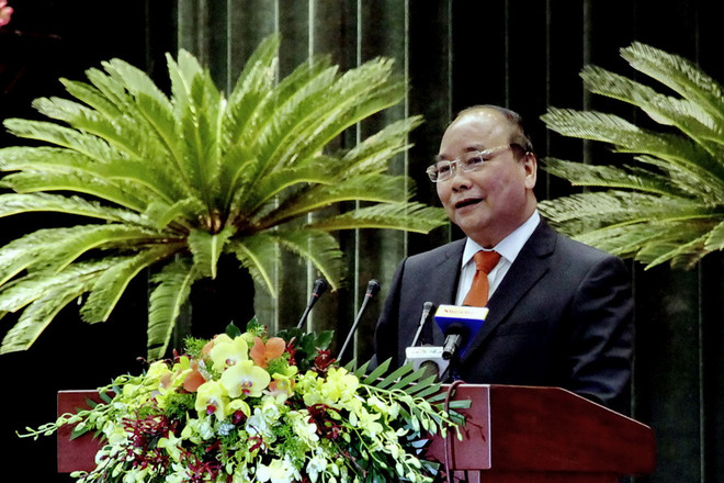 Thủ tướng Nguyễn Xuân Phúc đến dự và phát biểu tại Hội nghị Người Việt Nam ở nước ngoài trên thế giới năm 2016. (Ảnh: Thế Anh/TTXVN) Thủ tướng: Đất nước luôn chào đón những người con của dân tộc trở về ảnh 1