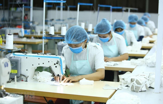 Ảnh minh họa (Nguồn: AFP/TTXVN) Tỷ lệ lao động nữ có việc làm phi chính thức tăng trưởng trong quý 1 ảnh 1