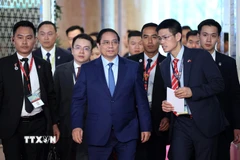 Thủ tướng Phạm Minh Chính đến dự phiên thảo luận. (Ảnh: Dương Giang/TTXVN)