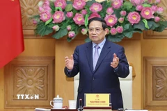 Thủ tướng Chính phủ Phạm Minh Chính đối thoại với các doanh nghiệp Nhật Bản. (Ảnh: Dương Giang/TTXVN)