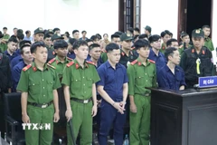 Các bị cáo tại phiên tòa. (Ảnh: Đậu Tất Thành/TTXVN)