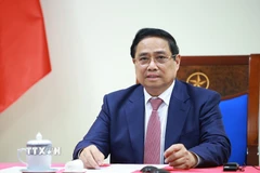 Thủ tướng Phạm Minh Chính điện đàm với Tổng thống Angola João Manuel Gonçalves Lourenço. (Ảnh: Dương Giang/TTXVN)