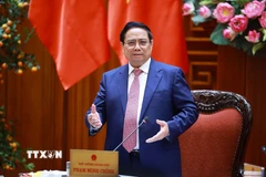 Thủ tướng Phạm Minh Chính chủ trì họp Thường trực Chính phủ về bình ổn giá xăng dầu. (Ảnh: Dương Giang/TTXVN)