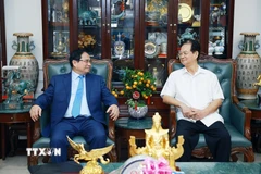 Thủ tướng Phạm Minh Chính chúc Tết gia đình đồng chí Nguyễn Tấn Dũng, nguyên Thủ tướng Chính phủ. (Ảnh: Dương Giang/TTXVN)