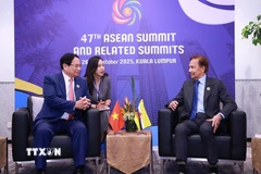 Thủ tướng Phạm Minh Chính gặp Quốc vương Brunei Hassanal Bolkiah. (Ảnh: Dương Giang/TTXVN)