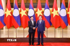 Chủ tịch Quốc hội Trần Thanh Mẫn hội kiến Tổng Bí thư, Chủ tịch nước Lào Thongloun Sisoulith. (Ảnh: Doãn Tấn/TTXVN)