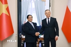 Thủ tướng Phạm Minh Chính hội kiến Tổng thống Ba Lan Andrzej Duda. (Ảnh: Dương Giang/TTXVN)