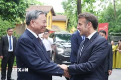 Tổng Bí thư Tô Lâm và Tổng thống Pháp Emmanuel Macron. (Ảnh: Thống Nhất/TTXVN)