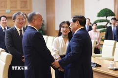 Thủ tướng Phạm Minh Chính tiếp đồng chí Lâm Vũ, Bí thư Tỉnh ủy Sơn Đông (Trung Quốc). (Ảnh: Dương Giang/TTXVN)