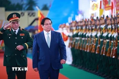 Thủ tướng Phạm Minh Chính dự Lễ kỷ niệm 80 năm Ngày truyền thống Lực lượng vũ trang Quân khu 5. (Ảnh: Dương Giang/TTXVN)
