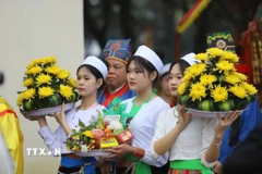 Vẻ đẹp của thiếu nữ dân tộc Mường tại Lễ hội. (Ảnh: Trọng Đạt/TTXVN)