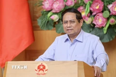 Thủ tướng Phạm Minh Chính chủ trì họp triển khai mô hình tổ chức chính quyền địa phương 2 cấp. (Ảnh: Dương Giang/TTXVN)