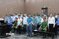 Các bị cáo tại phiên toà xét xử sáng 10/9. (Ảnh: Phạm Kiên/TTXVN)