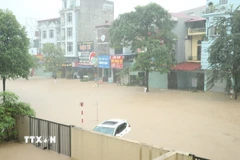Mưa lớn gây ngập lụt tại phường Phan Đình Phùng, tỉnh Thái Nguyên. (Ảnh: Quân Trang/TTXVN)
