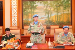 Thiếu tá Lê Vinh Hoàng hứa quyết tâm tại lễ trao Quyết định.(Ảnh: Trọng Đức/TTXVN)