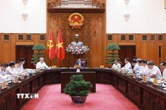 Thủ tướng Phạm Minh Chính chủ trì cuộc họp Thường trực Chính phủ với các địa phương để tháo gỡ khó khăn, vướng mắc cho các dự án tồn đọng. (Ảnh: Dương Giang/TTXVN)