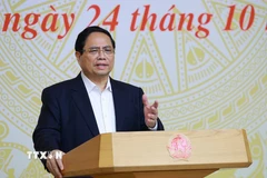 Thủ tướng Phạm Minh Chính làm việc về các giải pháp “phát triển đột phá nhà ở xã hội”. (Ảnh: Dương Giang/TTXVN)