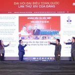 Các đại biểu tham dự nghi thức ấn nút khai trương và giao diện của Chuyên trang Đại hội Đại biểu toàn quốc lần thứ XIV của Đảng trên báo CAND. (Ảnh: CAND)