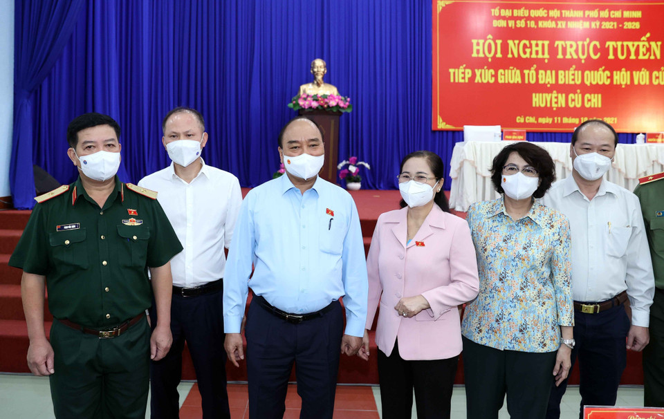 Chủ tịch nước Nguyễn Xuân Phúc và các đại biểu tại điểm cầu thị trấn Củ Chi. (Ảnh: Thống Nhất/TTXVN)