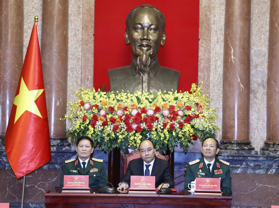 Chủ tịch nước Nguyễn Xuân Phúc chủ trì buổi gặp mặt. (Ảnh: Thống Nhất/TTXVN)