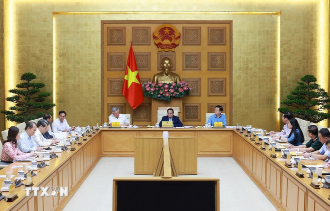 នាយករដ្ឋមន្ត្រី Pham Minh Chinh អញ្ជើញជាអធិបតីក្នុងកិច្ចប្រជុំបើកការតាំងពិពណ៌សមិទ្ធិផលរបស់ប្រទេសក្នុងឱកាសរំលឹកខួបលើកទី 80 នៃទិវាជាតិ។ (រូបថត៖ Duong Giang/VNA) ttxvn-2306-thu-tuong-hop-quoc-khanh-1.jpg