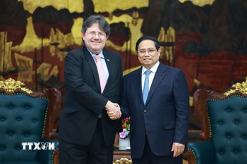 Thủ tướng Phạm Minh Chính tiếp Đại sứ Cộng hòa Áo tại Việt Nam Philipp Agathonos. (Ảnh: Dương Giang/TTXVN)